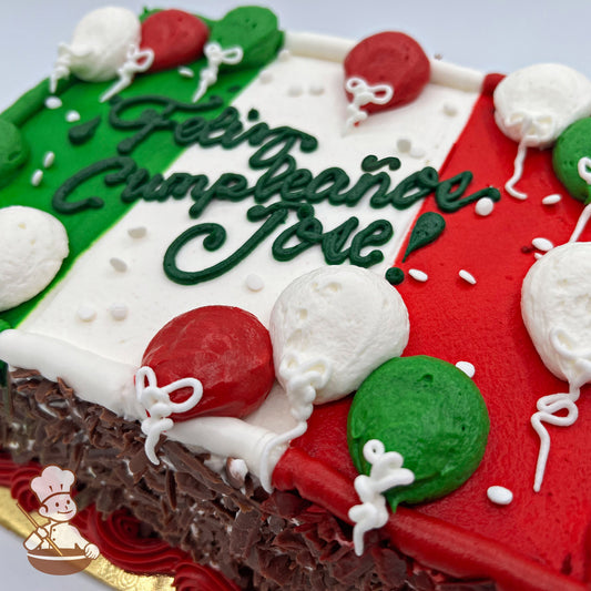 Sheet cake with Mexican flag colors, decorated with red, white, and green buttercream balloons. Chocolate shavings on the sides.