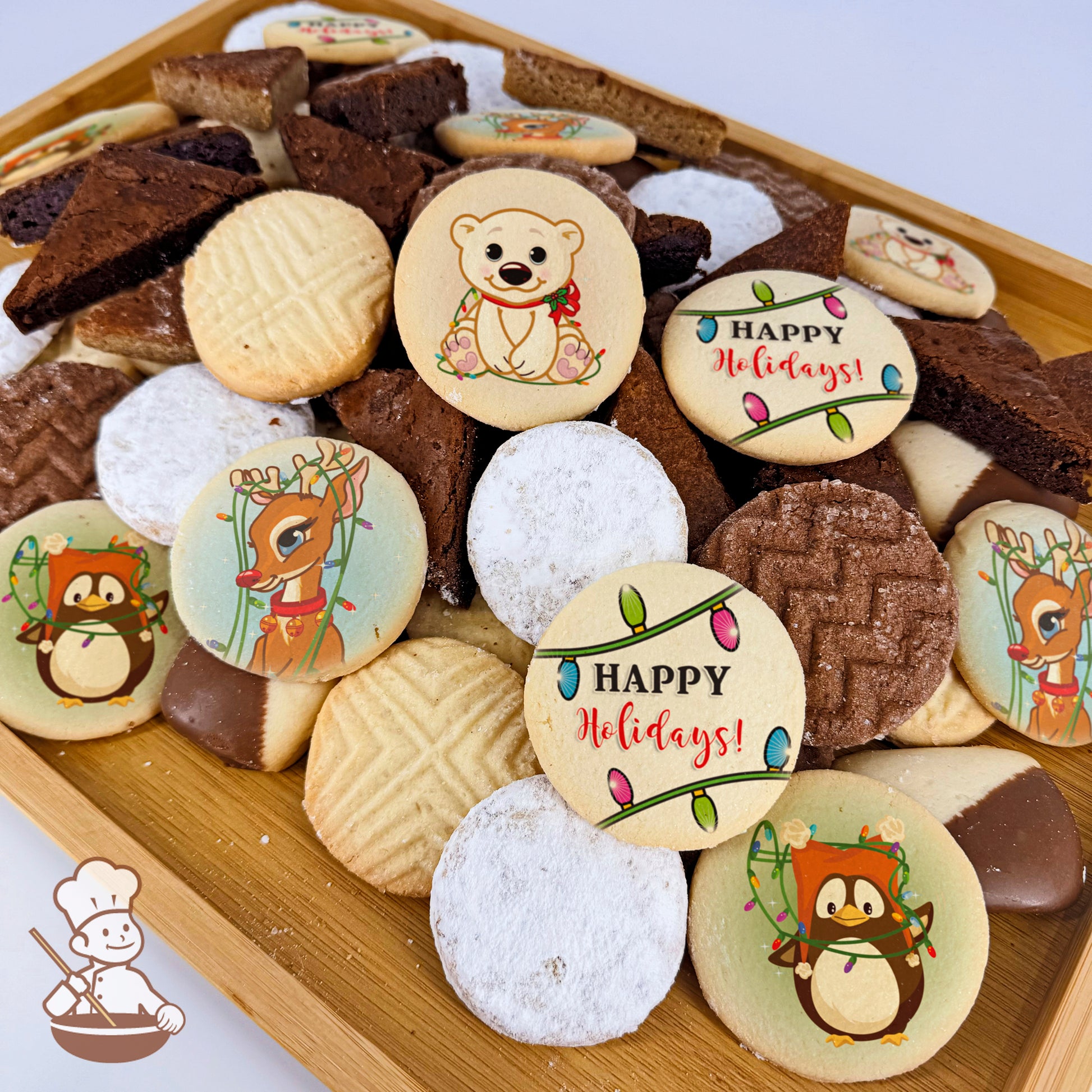 A wooden tray filled with assorted cookies and brownies. Cookies feature printed designs of a polar bear, reindeer, penguin, and "Happy Holidays" text.