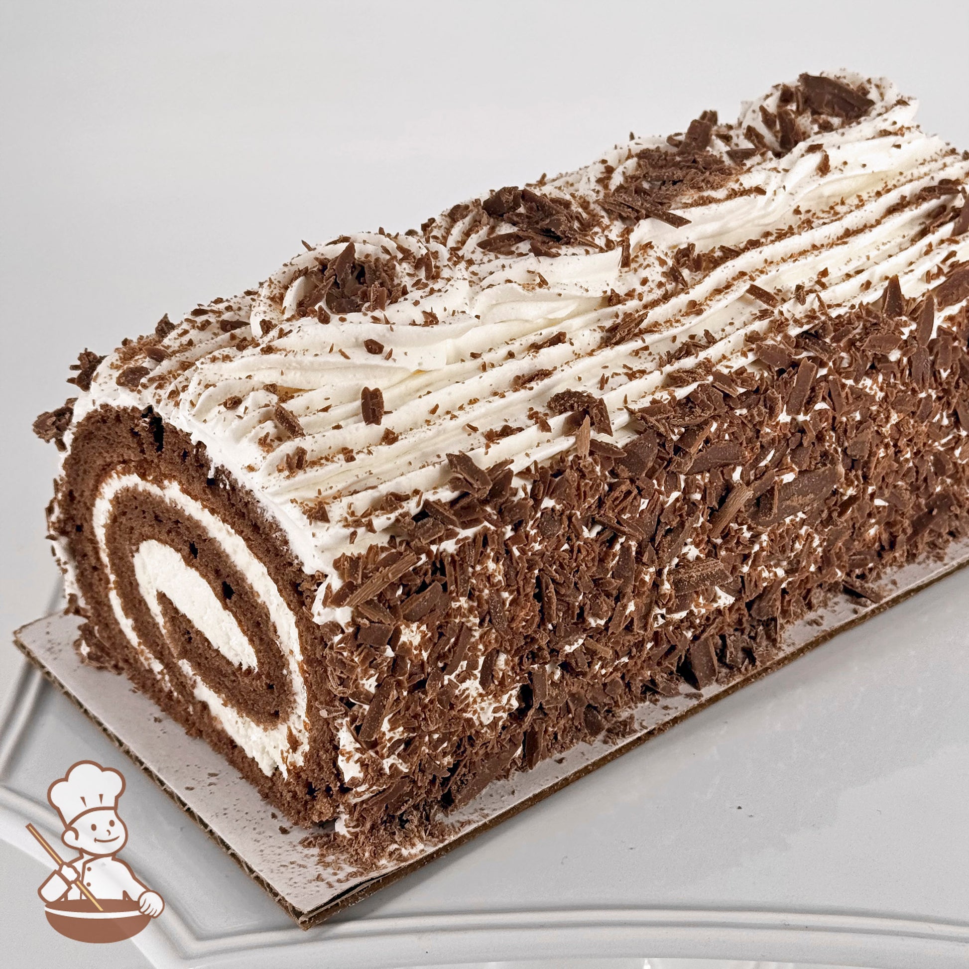 Chocolate chiffon dream cake log with whipped cream and Belgian chocolate shavings.