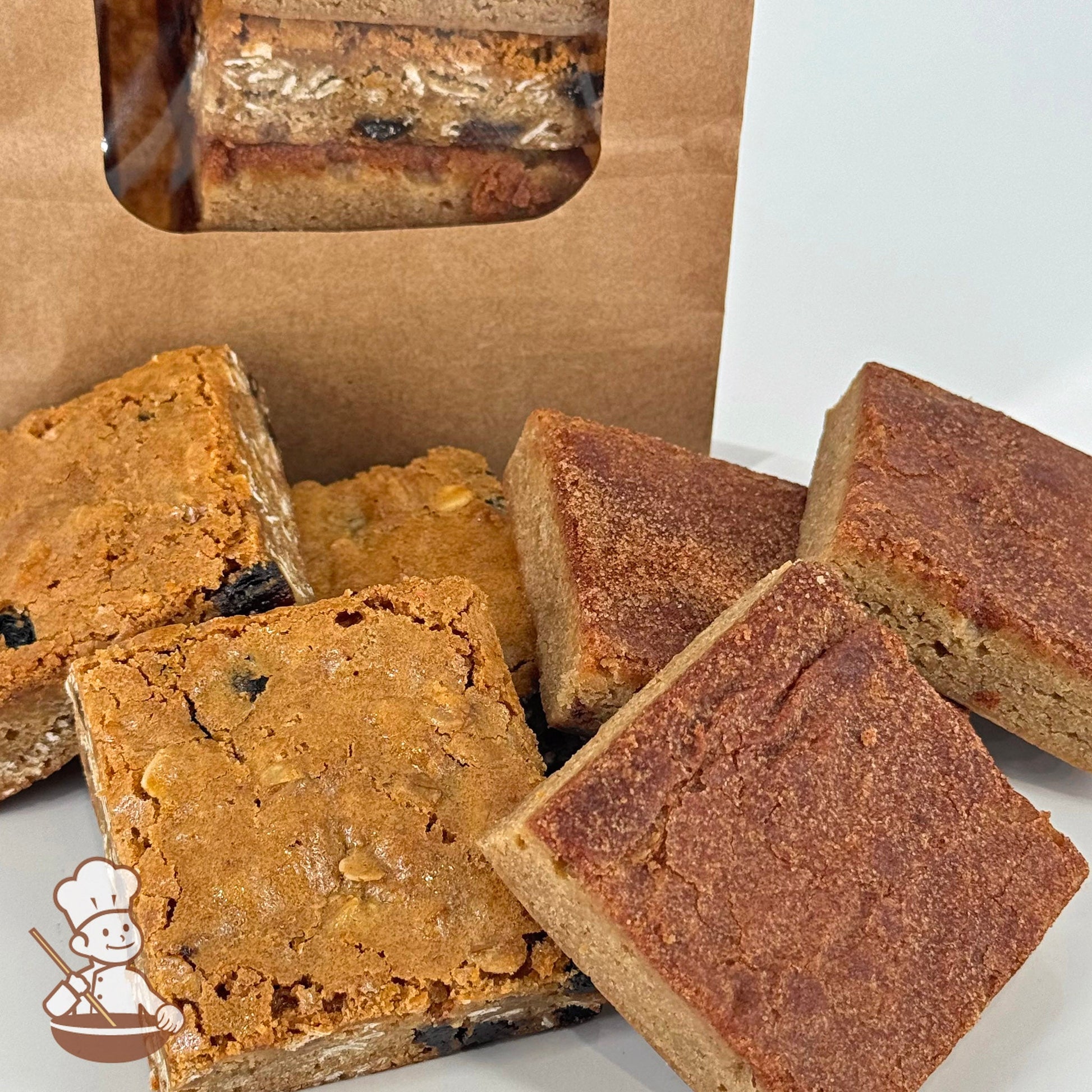 Three snickerdoodle blondies and three oatmeal raisin blondies are arranged together in front of a kraft window bag.