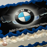 Close-up of a BMW logo on a car grille printed on a sheet cake.