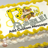 Illustration of Rubble from Paw Patrol with construction tools and the phrase "R is for Rubble" printed on a sheet cake.