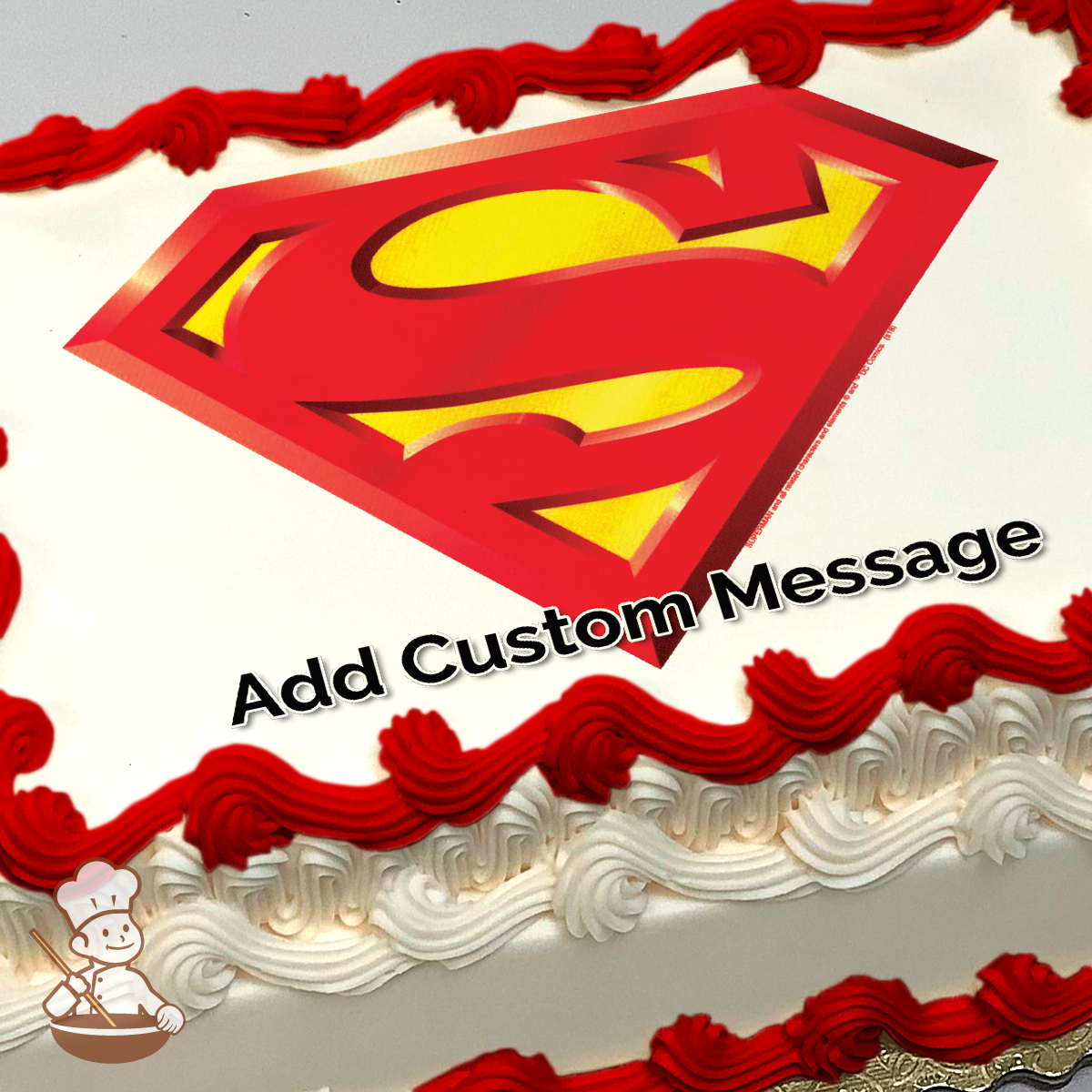 Iconic Superman logo with a red and yellow "S" shield on a grey background, printed on a sheet cake.