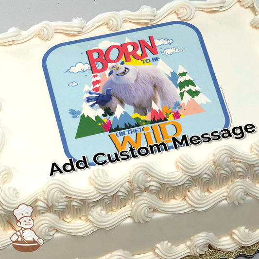 Illustration of a smiling yeti with the phrase "BORN TO BE WILD" against a mountainous backdrop, printed on a sheet cake.