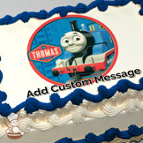 Illustration of Thomas the Tank Engine on a red and blue background, printed on a sheet cake.