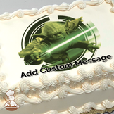 Illustration of Yoda with a lightsaber on a green and white circular background, printed on a sheet cake.