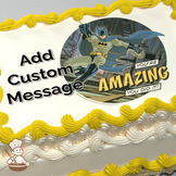 Batman with a grappling hook, against a Gotham City backdrop, with text "You're Amazing, You Did It!" printed on a sheet cake.