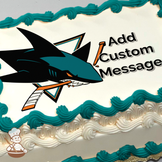 Illustration of a stylized shark with a hockey stick, set against a white background with a wave pattern, printed on a sheet cake.