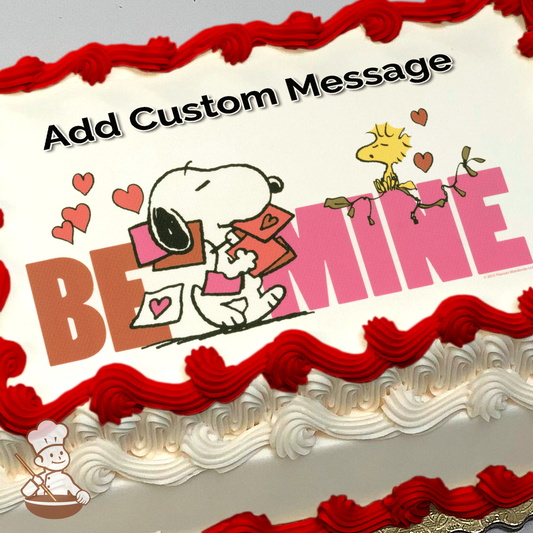 Illustration of Snoopy carry valentine cards and Woodstock sitting on large letters spelling "BE MINE", printed on a sheet cake.