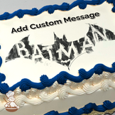 Batman logo with Gotham City silhouette in the background, printed on a sheet cake.