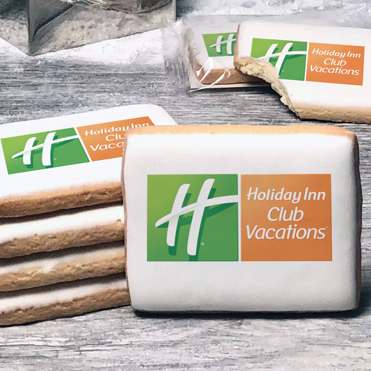 A stack of rectangle butter shortbread cookies with Holiday Inn Club Vacations logo printed directly on a white, lemon sugar icing.