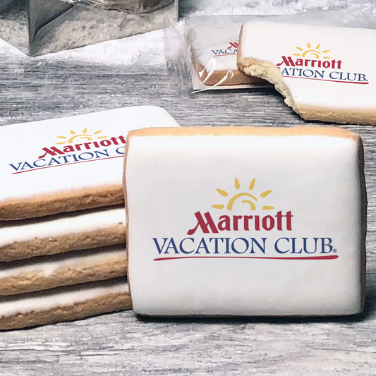 A stack of rectangle butter shortbread cookies with Marriott Vacation Club logo printed directly on a white, lemon sugar icing.