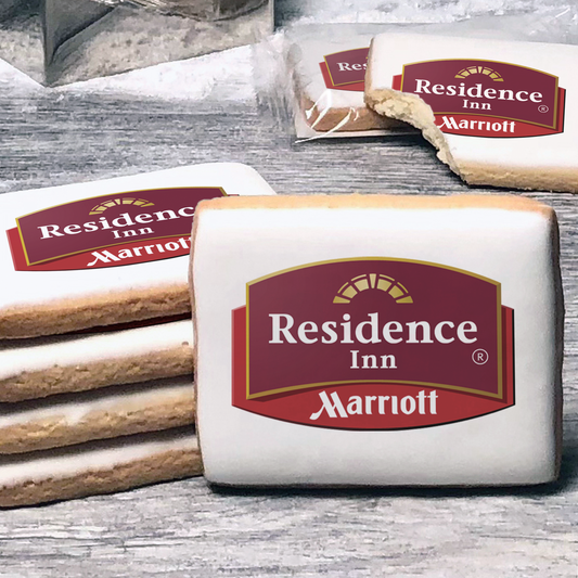 A stack of rectangle butter shortbread cookies with Residence Inn logo printed directly on a white, lemon sugar icing.