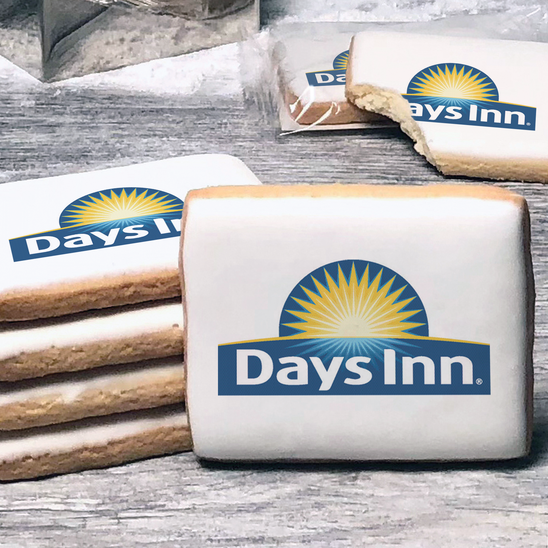 A stack of rectangle butter shortbread cookies with Days Inn logo printed directly on a white, lemon sugar icing.