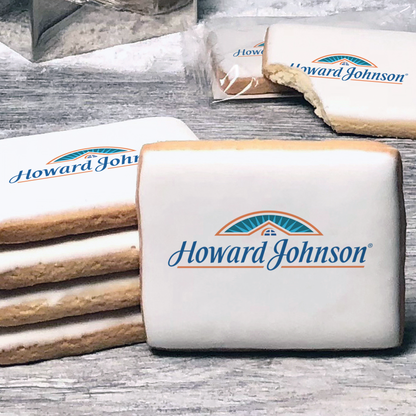 A stack of rectangle butter shortbread cookies with Howard Johnson logo printed directly on a white, lemon sugar icing.