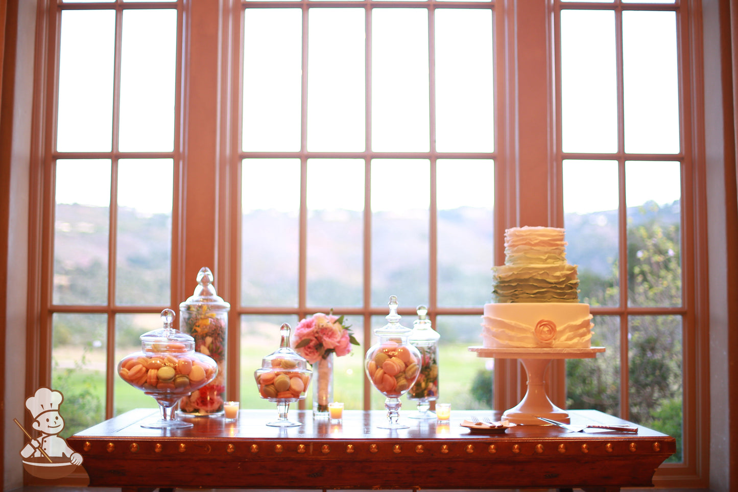 Macarons in apothecary jars Table Layout with Ruffle Fondant cake.